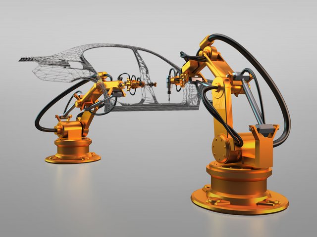 Zwei orangefarbene Industrieroboterarme, die an einer transparent dargestellten Fahrzeugkarosserie arbeiten