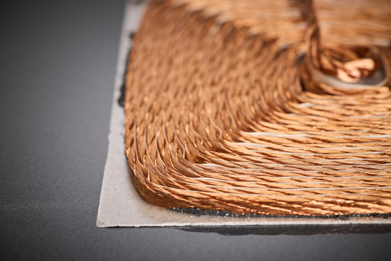 The optimized winding geometry of the HF litz wire ensures homogeneous current distribution, reduced AC losses, and stable thermal performance within encapsulated high-performance charging pads at 85 kHz.