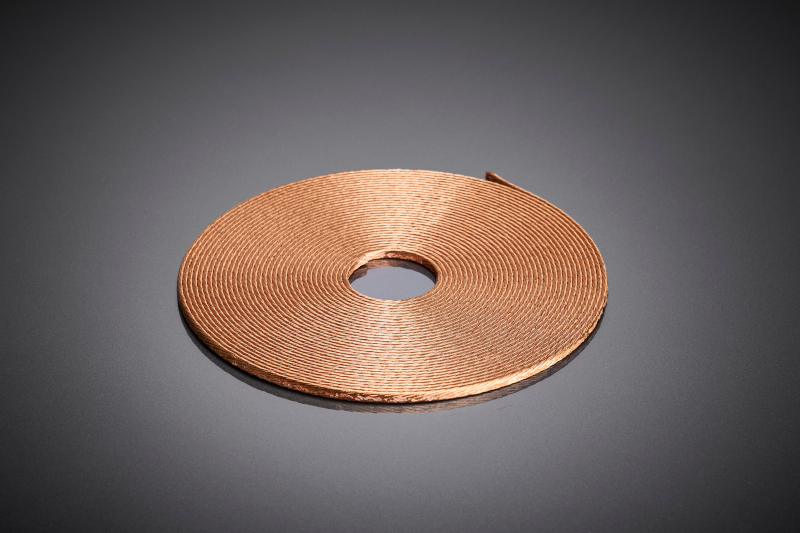 The flat-designed coil with RUPALIT® Profile litz wire forms the basis for compact Qi2 in-cabin charging pads and supports efficient energy transfer with limited installation space and increased power density.