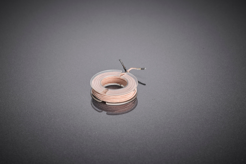 Compact toroidal coil made of fine copper litz wire for use in inductive proximity switches. The precise winding enables reliable detection, high repeatability, and stable electrical properties with limited installation space.