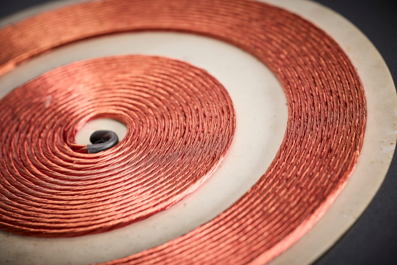 The densely packed, profiled litz wire structure supports a high copper fill factor and is designed for maximum power density under the glass ceramic.