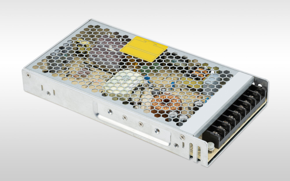 Open industrial switched-mode power supply with transformer and power electronics, exemplary of compact and efficient power supply solutions in industrial electronics.